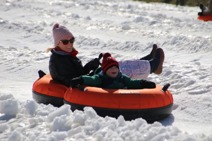a person riding a snow board in the water