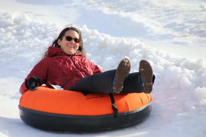 a person riding on the back of a boat