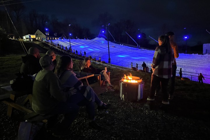 a group of people that are lit up at night